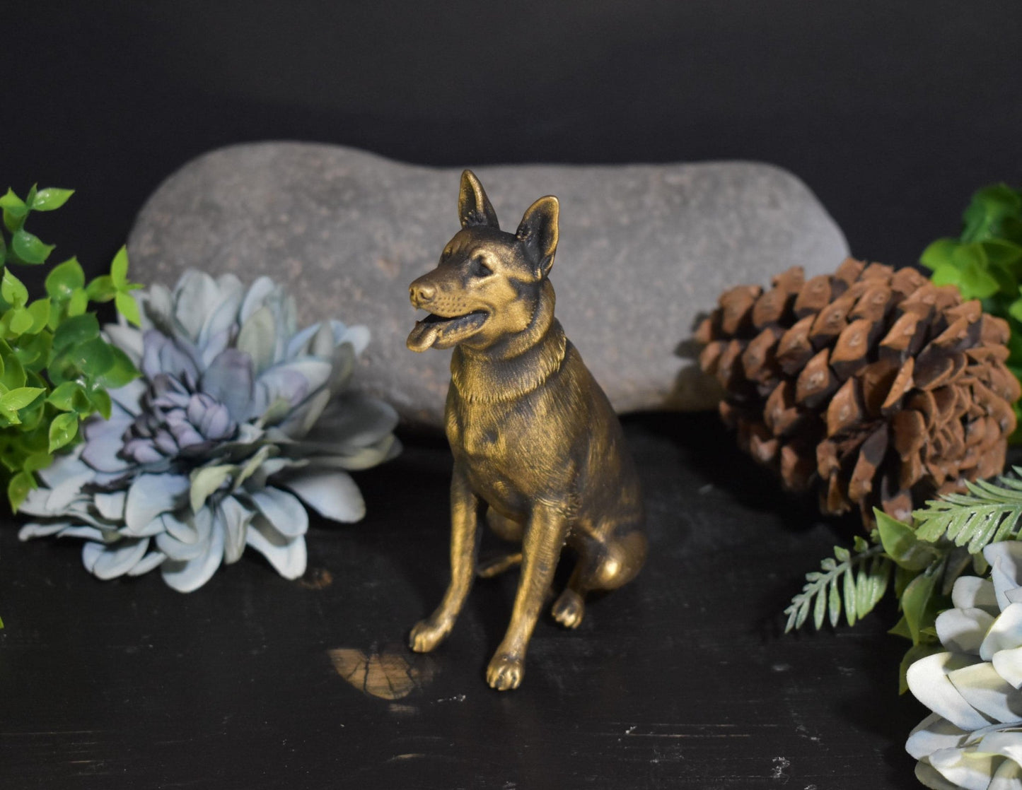Left side of a black and gold German Shepherd sitting statue, perfect for collectors and dog lovers.